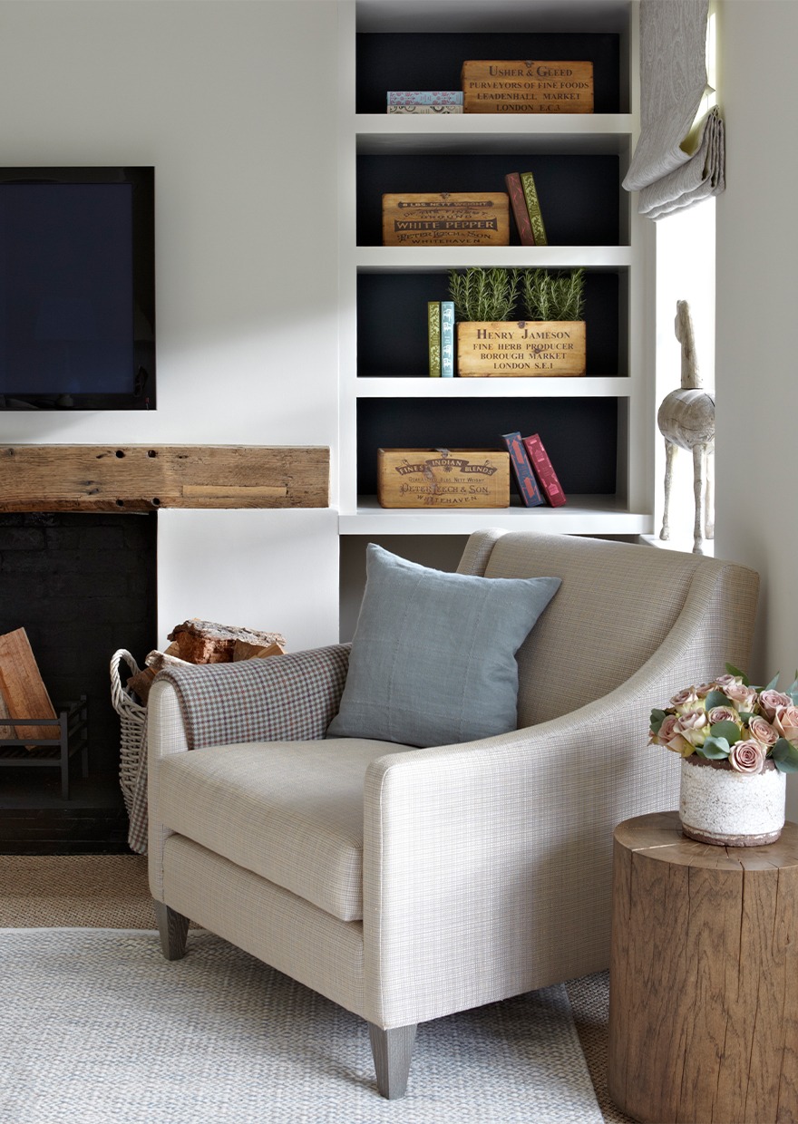 Armchair with fireplace and accessorised joinery