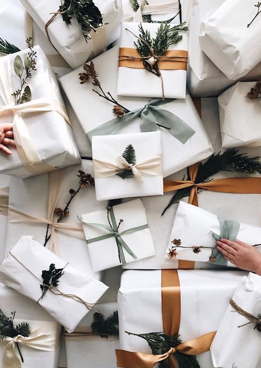 Christmas Presents with organic ribbons and natural woods and pine cones